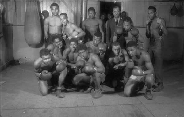 "2603 Co. Civilian Conservation Corps Camp Vermilion, Dnasville, Ill[inois]. Boxing team. Mr. Taylor trainer."