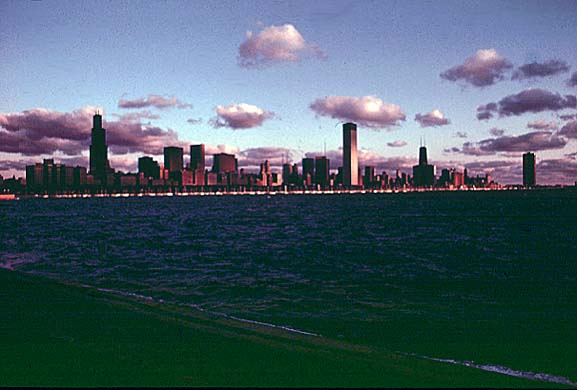 Sunrise on Lake Michigan with Chicago shown in the background. March 1973 (NWDNS-412-DA-13736)