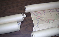 Rolled map that is torn in half