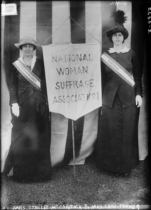 Katharine McCormick with a woman suffrage banner