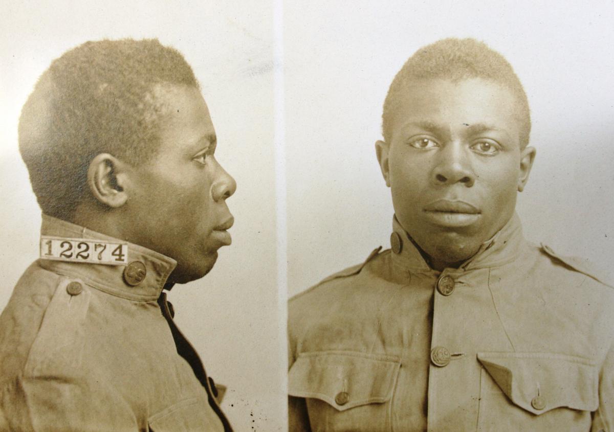 mugshot showing front and profile of a man in military uniform