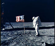 Aldrin posing by flag on moon's surface