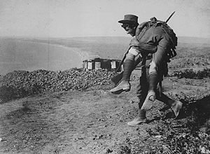 The irrepressible Australians at Anzac. An Australian bringing in a wounded comrade to hospital. Dardanelles Campaign, circa 1915
