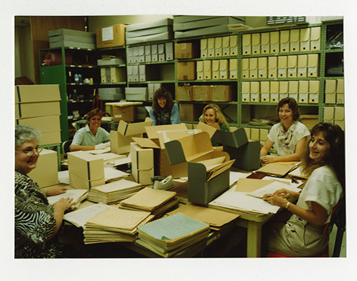 Staff and volunteers processing archival collections [NAID 29011076]
