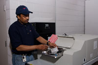 A Philadelphia staff member securely erases data with a degausser