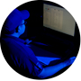 man sitting at a computer screen