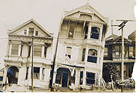 houses shaken by earthquake lean precariously.