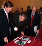 Attendees view the exhibit.