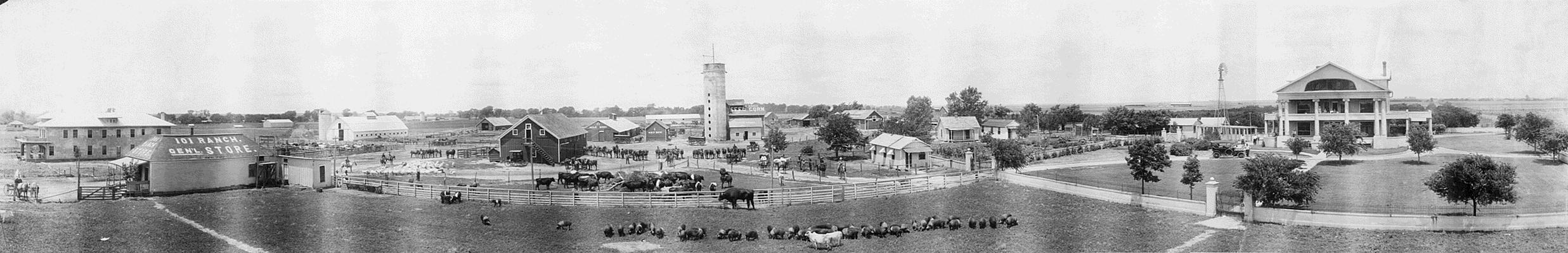 View of farm buildings, residences, ranch hands, farm machinery, and animals at the 101 Ranch in Oklahoma, between Ponca City and Perry. The ranch was owned by the Miller family.
