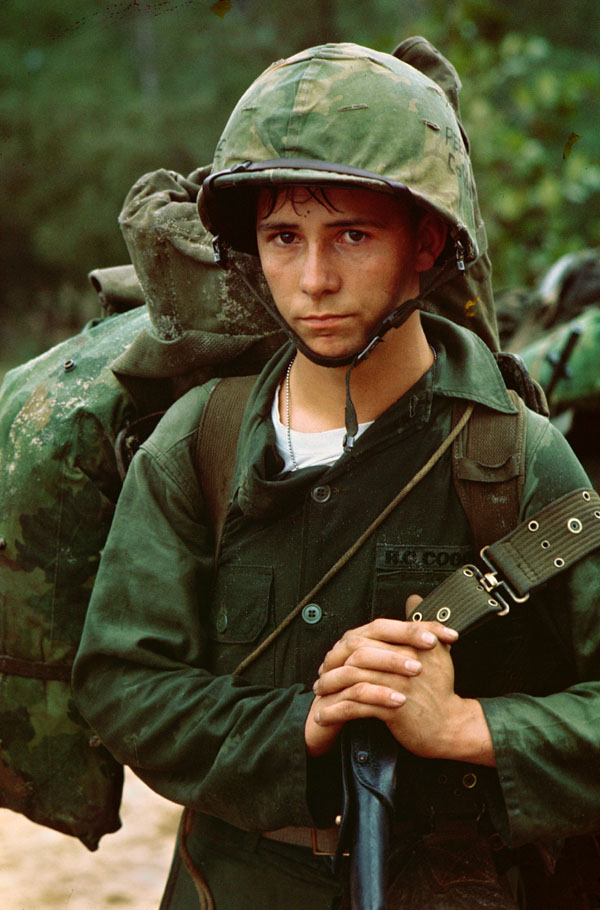 "Da Nang, Vietnam... A young Marine private waits on the beach during the Marine landing."
