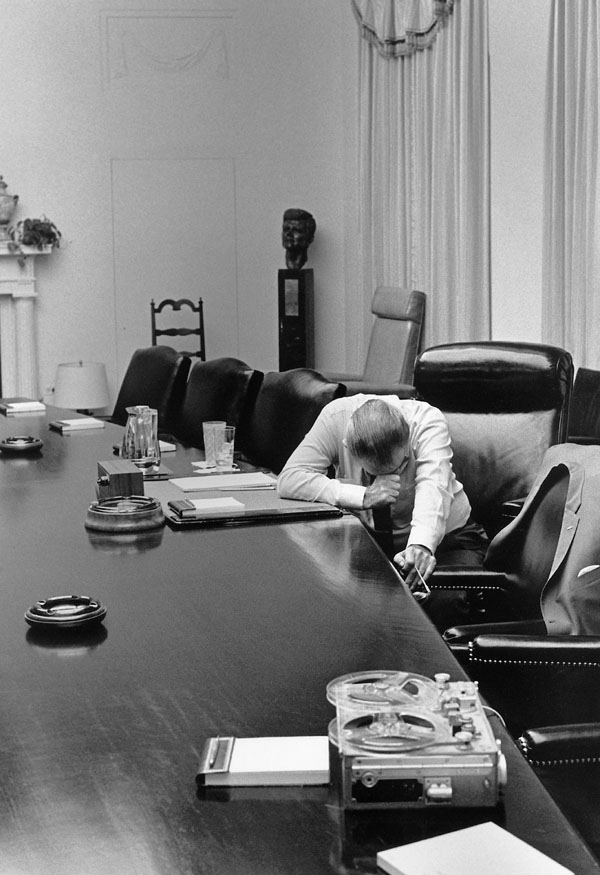 "President Lyndon Johnson listens to a tape recording from his son-in-law CaptCharles Robb....".