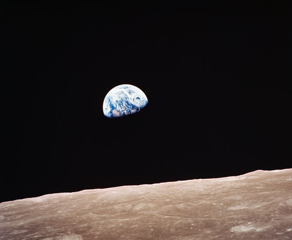 "Rising earth greets Apollo VIII astronauts as hey come from behind the moon..."