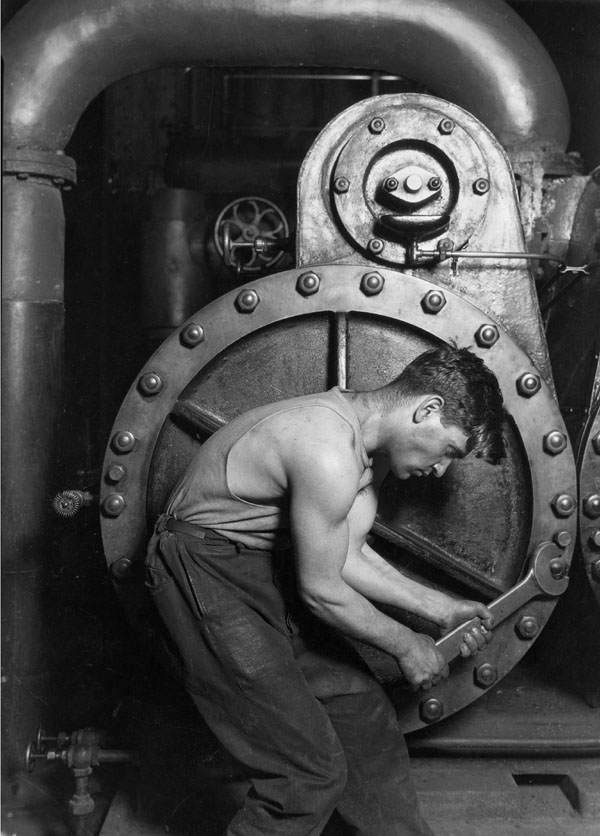 "Power house mechanic working on steam pump"