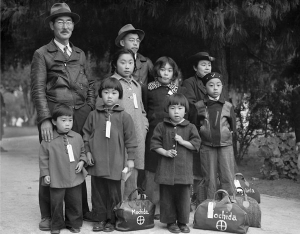 "Members of the Mochida family awaiting evacuation bus..."