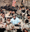 President George Bush enjoys Thanksgiving Dinner with U.S. troops
