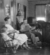 Farm family listening to their radio