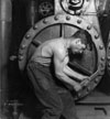 Power house mechanic working on steam pump