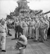 Japanese prisoners of war are bathed, clipped, "deloused," and issued GI clothing as soon as they are taken aboard the USS New Jersey