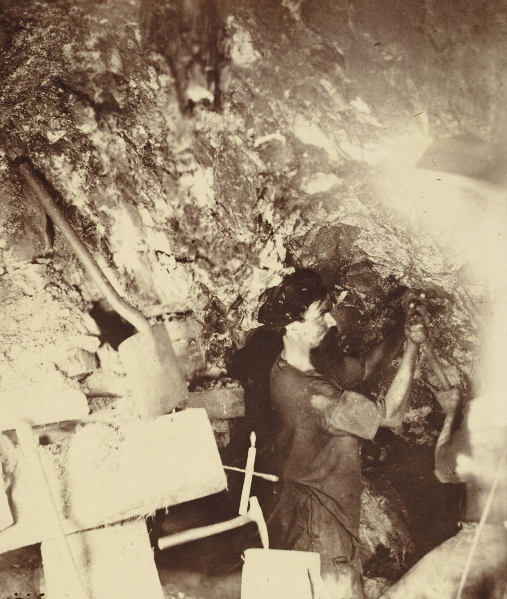 Miner underground in Virginia City, NV mine – Source: NARA’s The Way We Work Exhibit