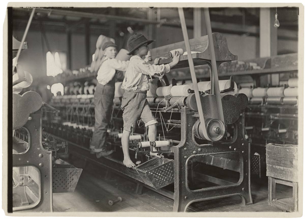 Bibb Mill in Macon, GA: mending broken threads and empty bobbins – – Source: NARA’s The Way We Work Exhibit