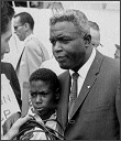 Jackie Robinson and son David being interviewed at the March on Washington, 1963