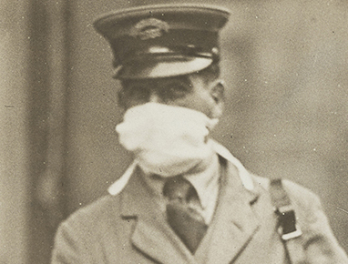Mail carrier wearing a mask during the 1918 flu outbreak