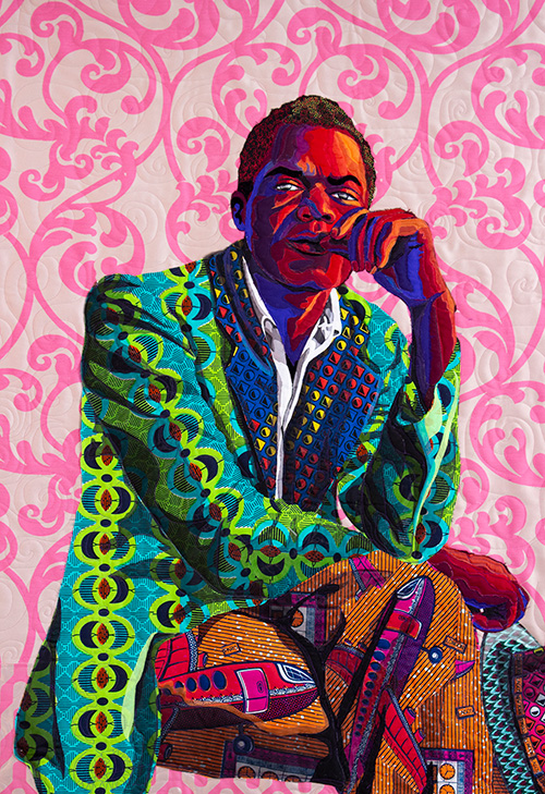 A quilted portrait of a seated man wearing a rumpled suit, staring at the camera pensively with his left hand to his mouth, rendered in a diversity of patterns in saturated reds, teals, lime greens, and golds.