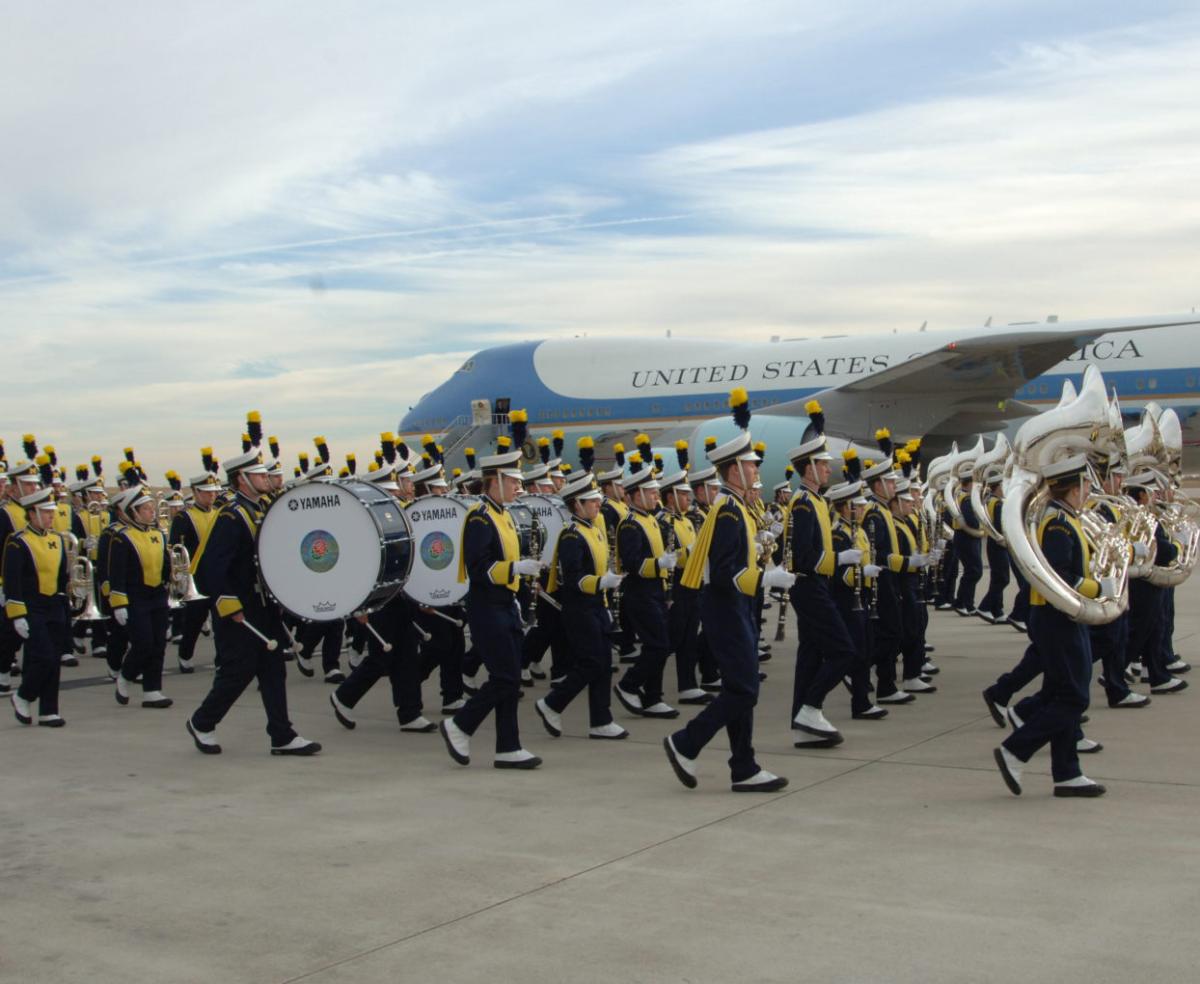 University of Michigan marching band play at the airport when the plane carrying President Ford's body arrived