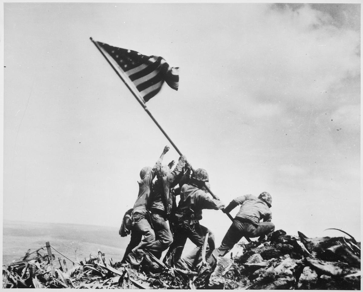 Marines on Iwo Jima raise US flag on Mt Suribachi