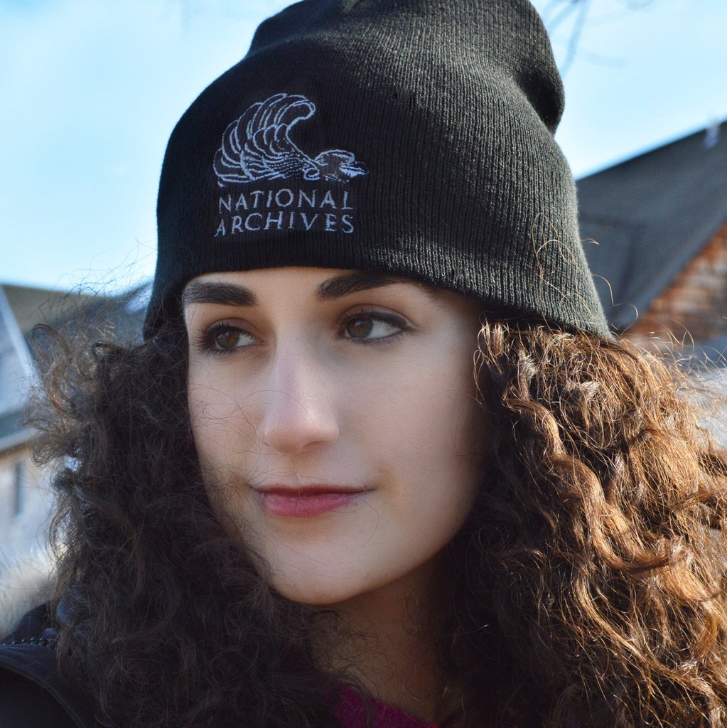 Model wearing National Archives knitted hat