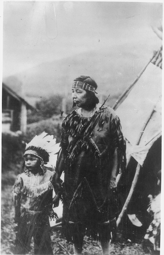Native American child and adult