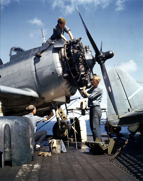 Mechanics overhaul engine of F6F on carrier in Pacific