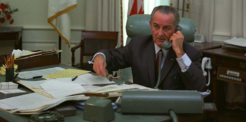 President Lyndon Johnson on the telephone in the Oval Office