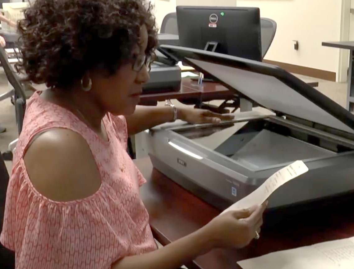 A genealogist scans pension records at the Buffalo Soldiers scan-a-thon
