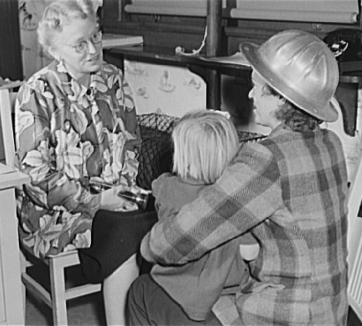 During World War II, a war worker drops off her child at day care