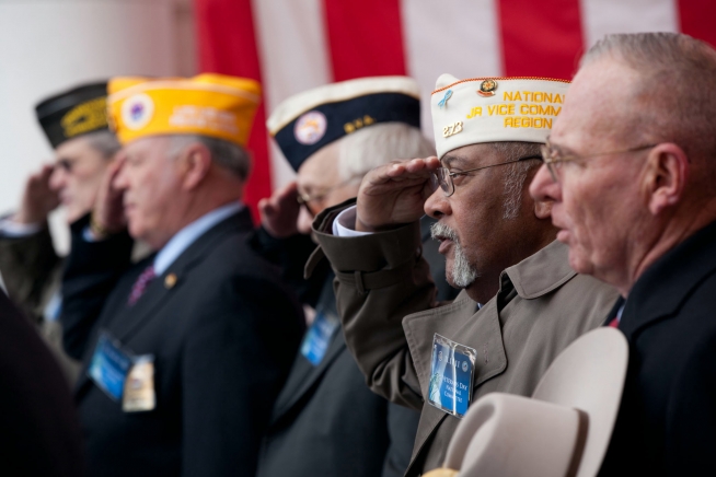 veterans salute at a Veterans Day event at Arlington Cemetery
