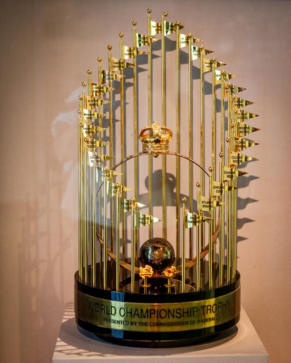 color close-up photograph of a large golden trophy in a case