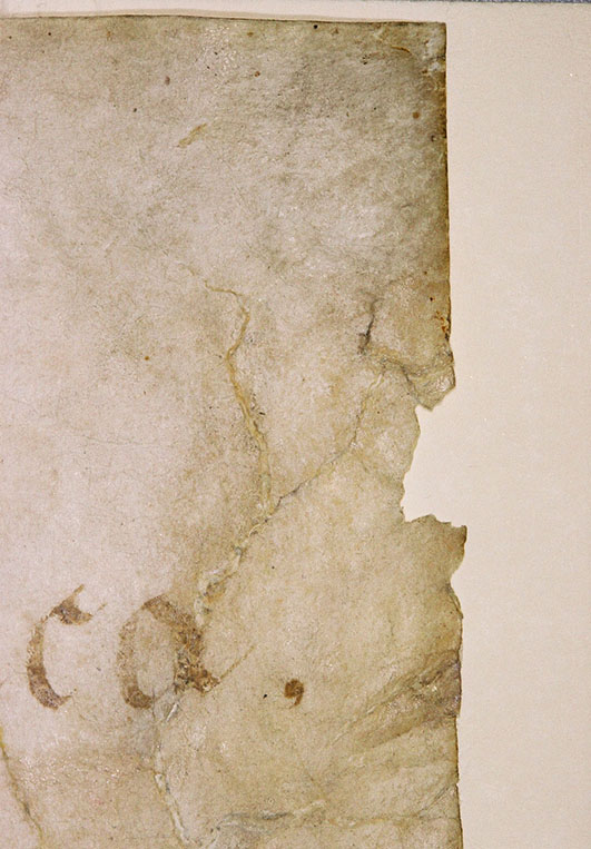 Detail of tear at corner of Declaration of Independence before conservation treatment