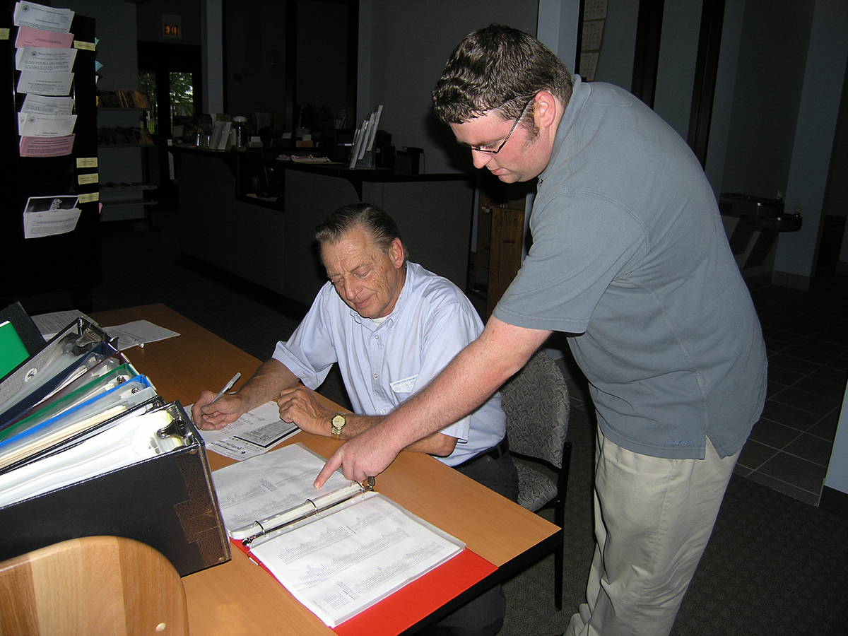 Thomas Hayes, archives aid in the Great Lakes region in Chicago, assists a researcher