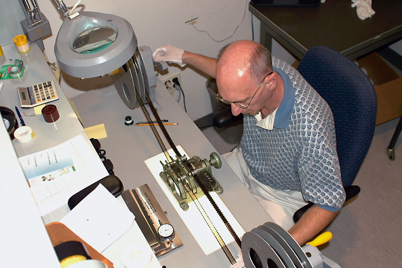 Lead motion picture preservation specialist Charles Joholske examines original Kodachrome motion picture