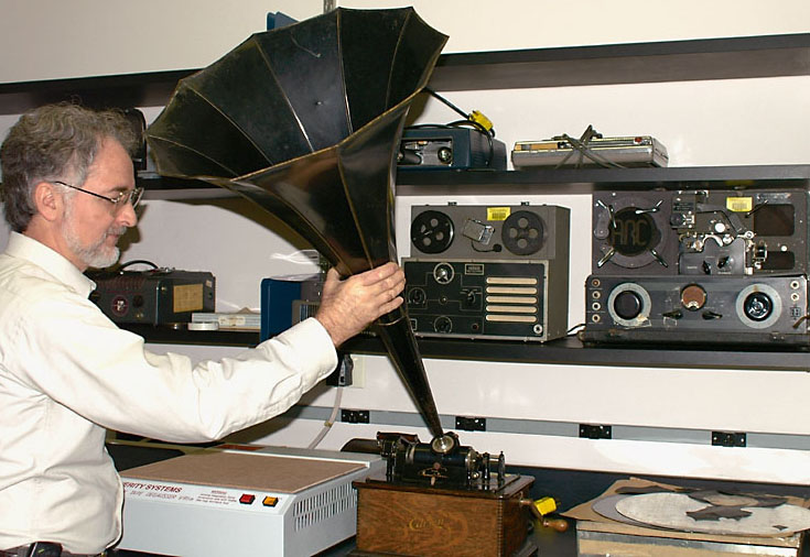 Clarence Simmons, chief of the Special Media Laboratory, holds an Edison standard phonograph