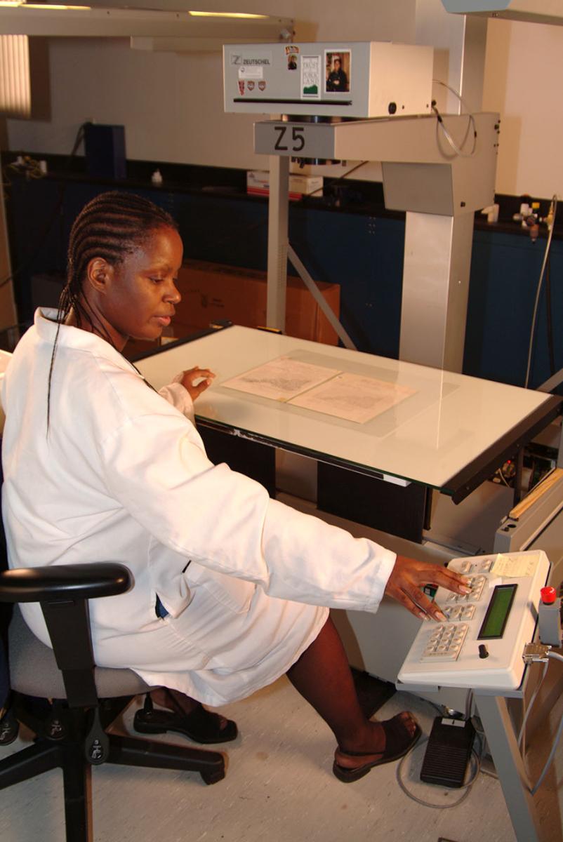 Micrographic technician Rebecca Sullivan works on microfilming original documents