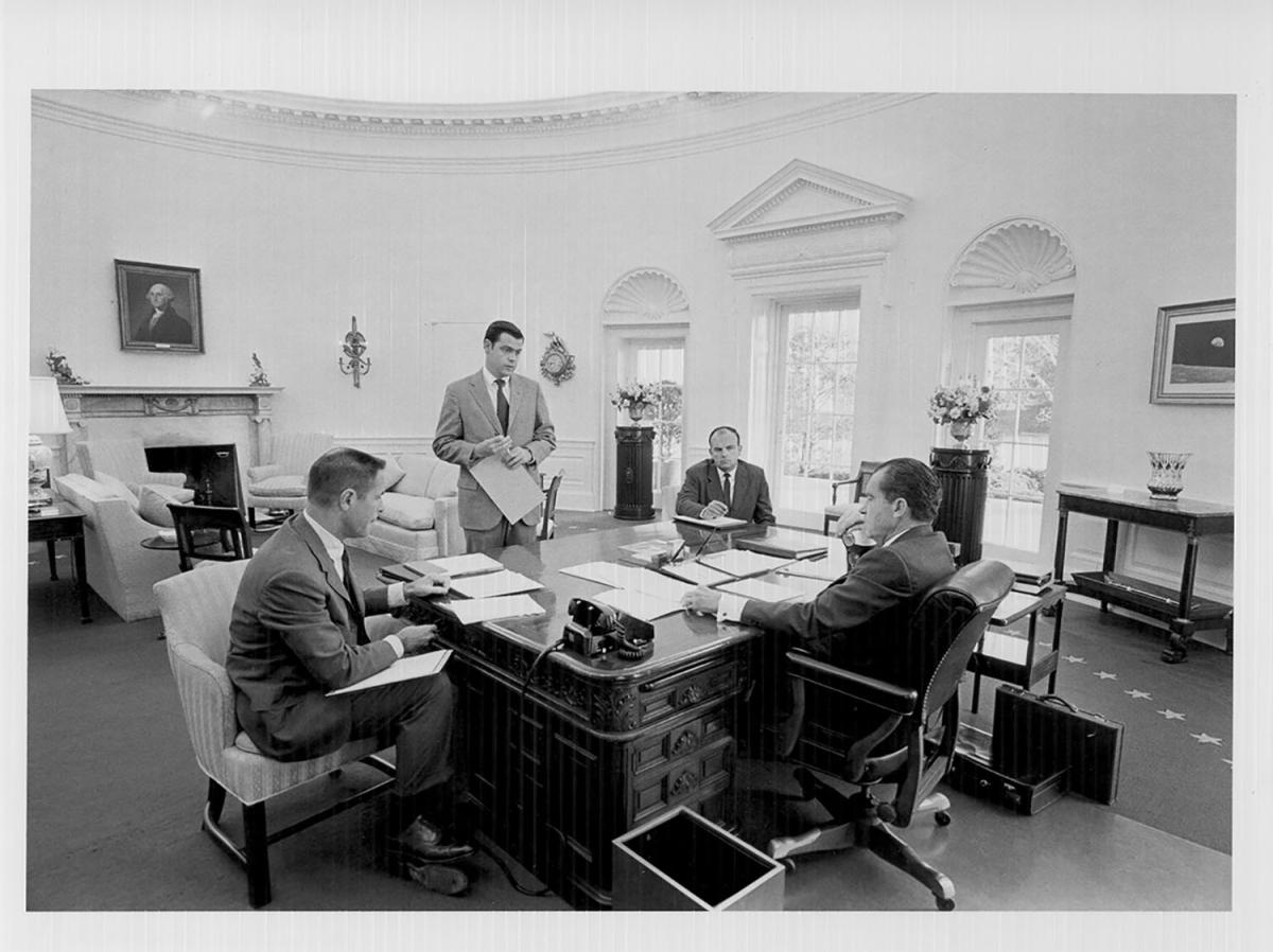 President Richard Nixon (seated at right) meets with staff on March 13, 1970. From left are H. R. Haldeman, Dwight Chapin, and John D. Ehrlichman