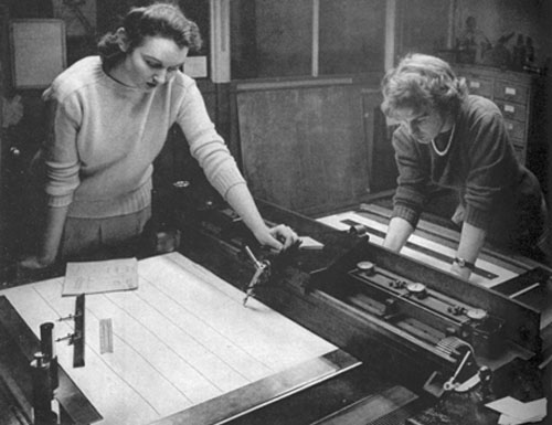 Barbara Clayton (left) and Patricia Hayes use a projection machine