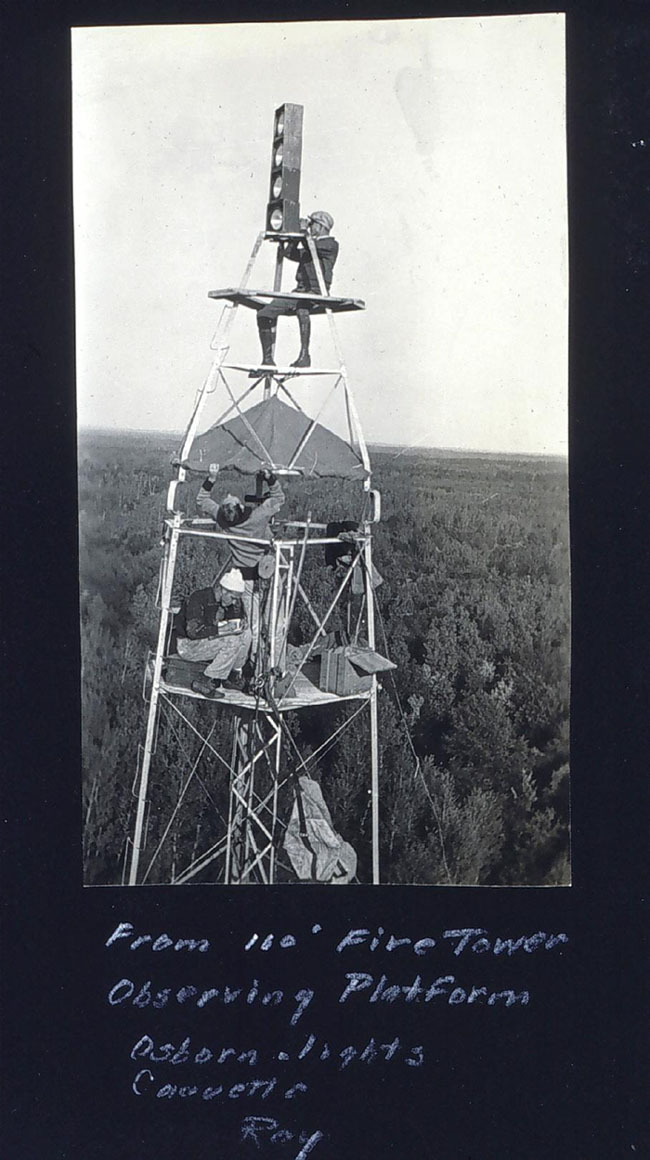A survey party installing lights on a tower at geodetic station Northome