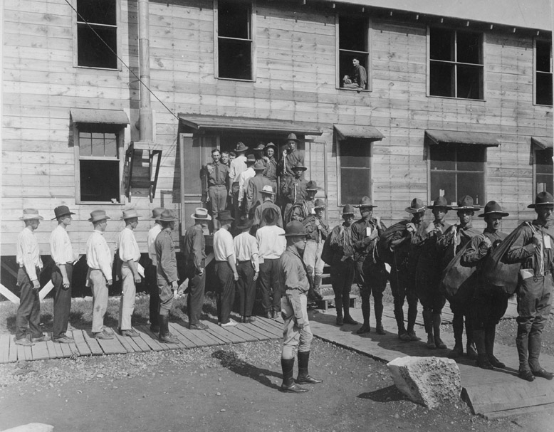 Men drafted into the Army report for service at Camp Travis, San Antonio, Texas