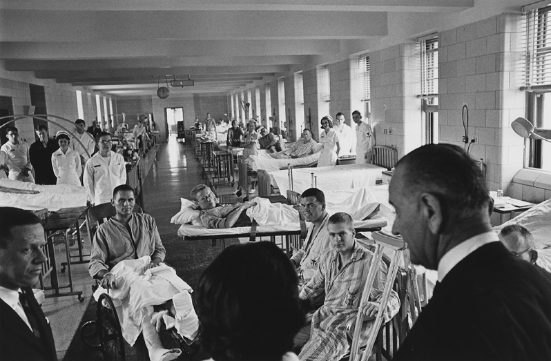 At Bethesda Naval Hospital in Maryland, President Johnson visits wounded troops