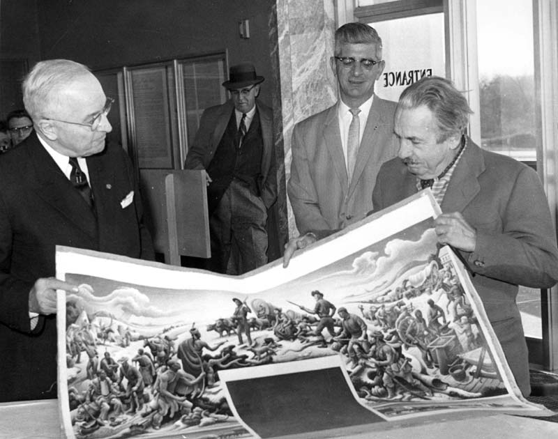 Truman and Benton hold up the final cartoon for photographers
