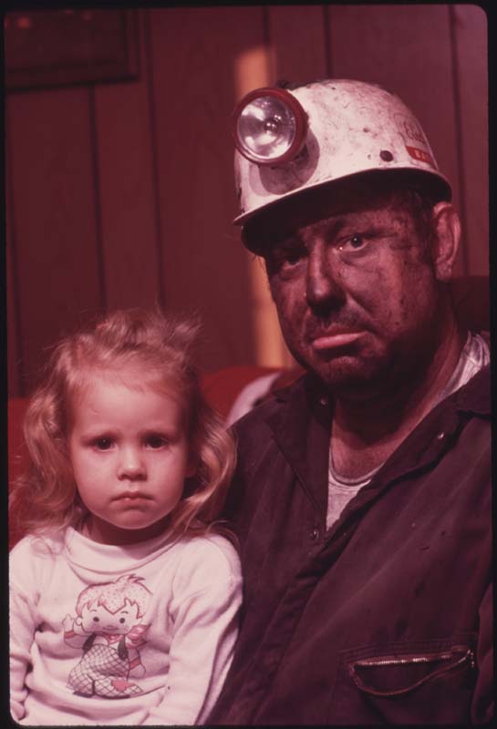 A Tennessee coal miner with his young daughter photographed by Jack Corn
