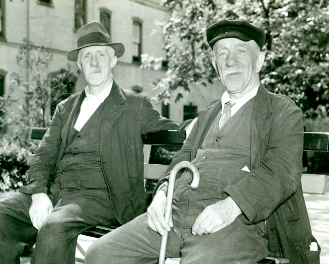 Two older men sitting on a bench